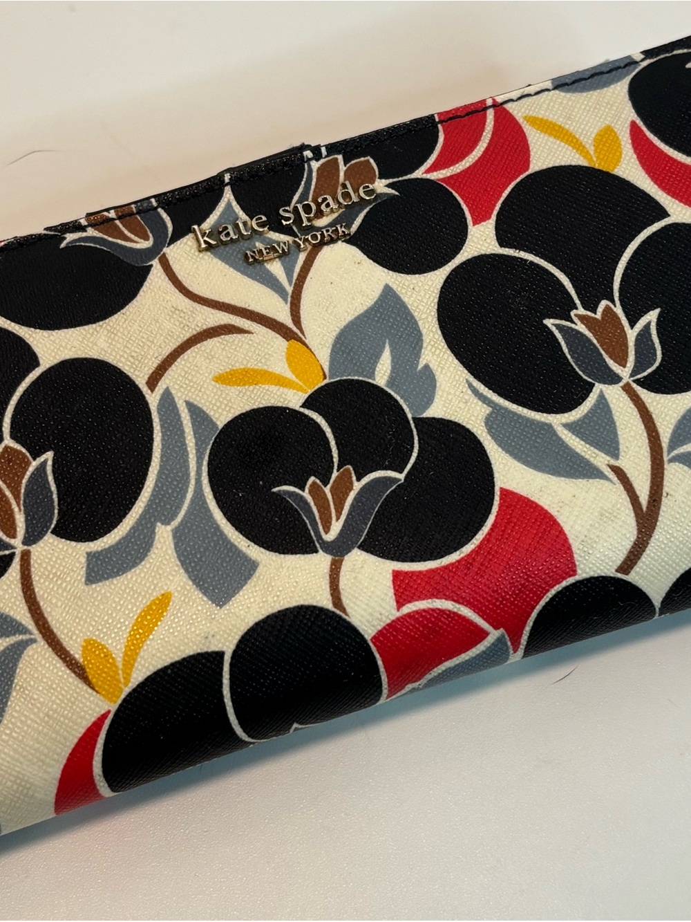 KATE SPADE ($169) Cameron Breezy Floral Slim Bifold Wallet with Navy Interior